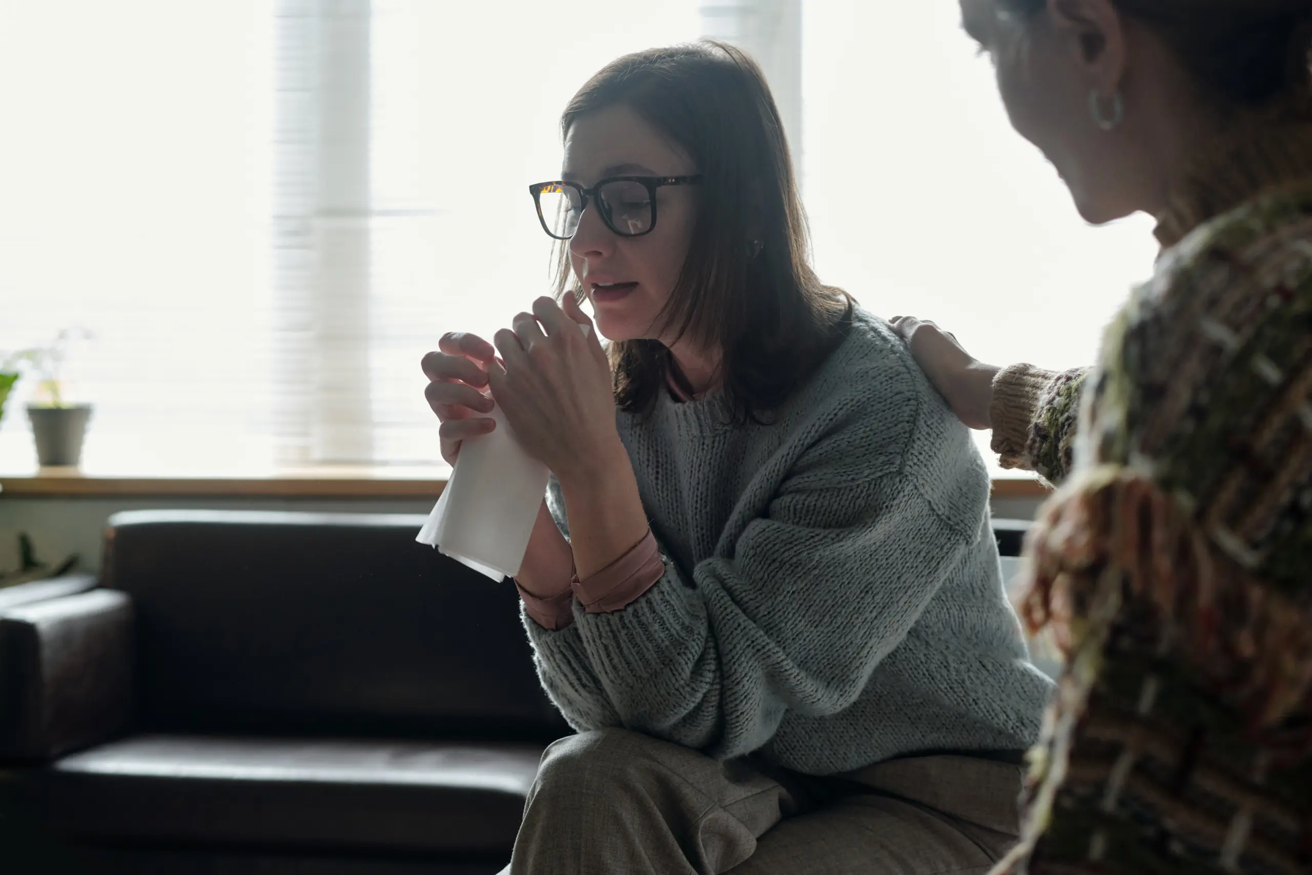 Client receiving emotional support and guidance in therapy