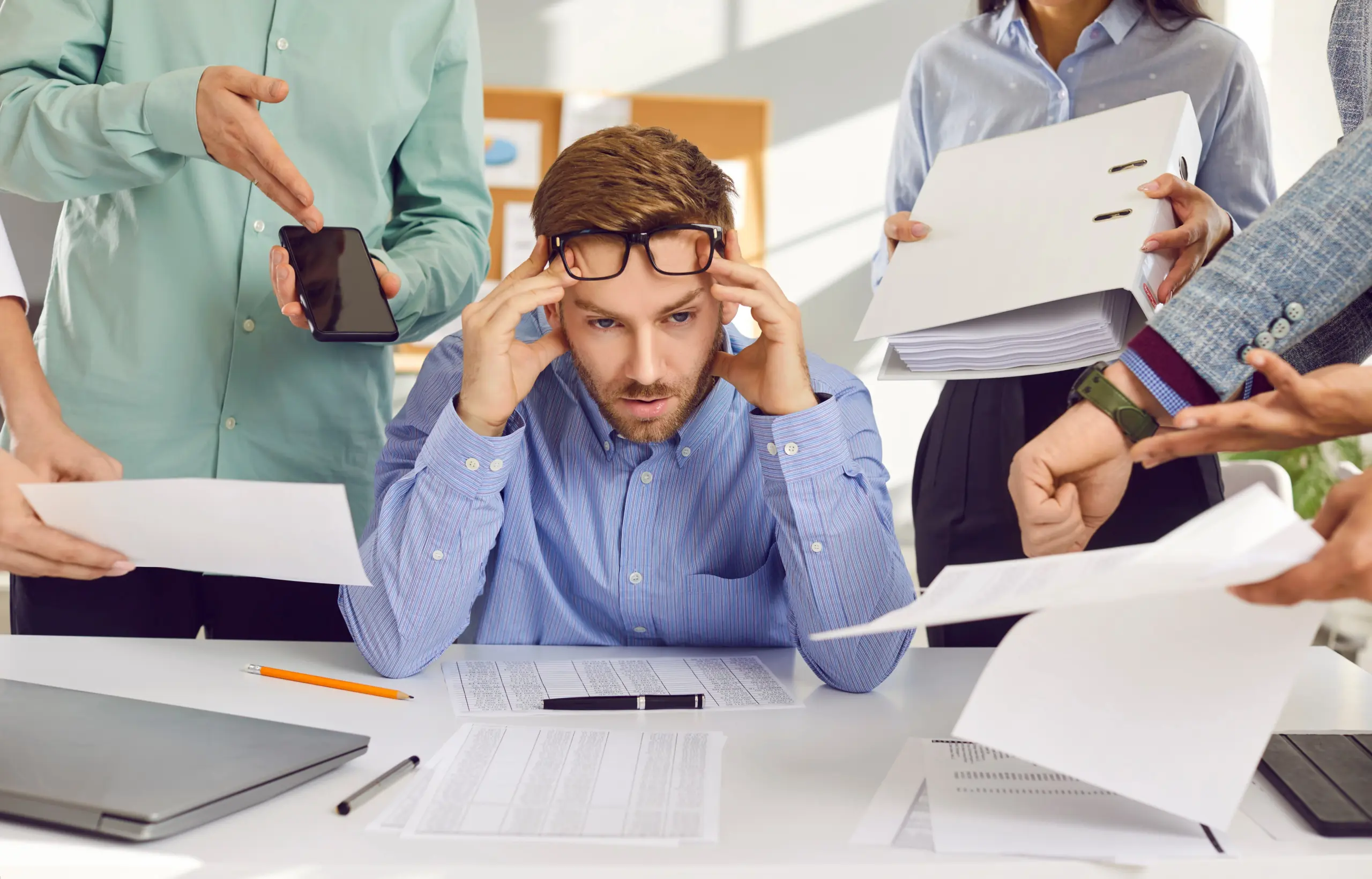 Person overwhelmed by tasks showing signs of being addicted to always being busy