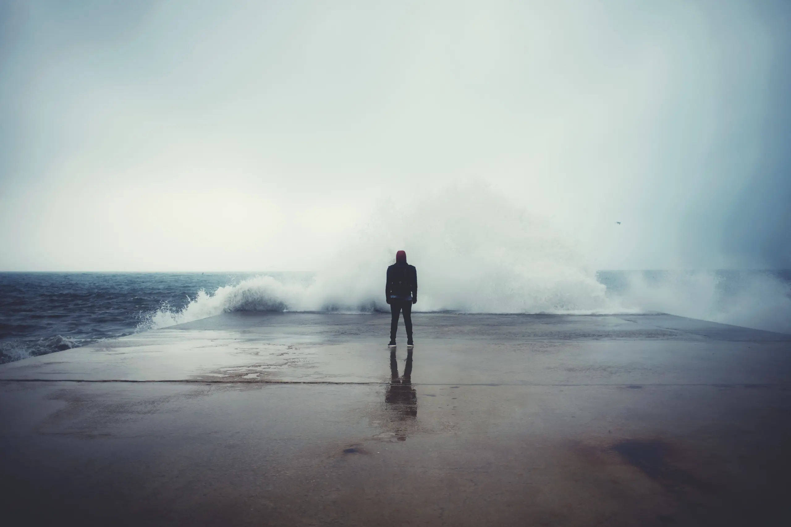 Visual metaphor for emotional regulation in recovery: standing stable while riding the emotional wave.