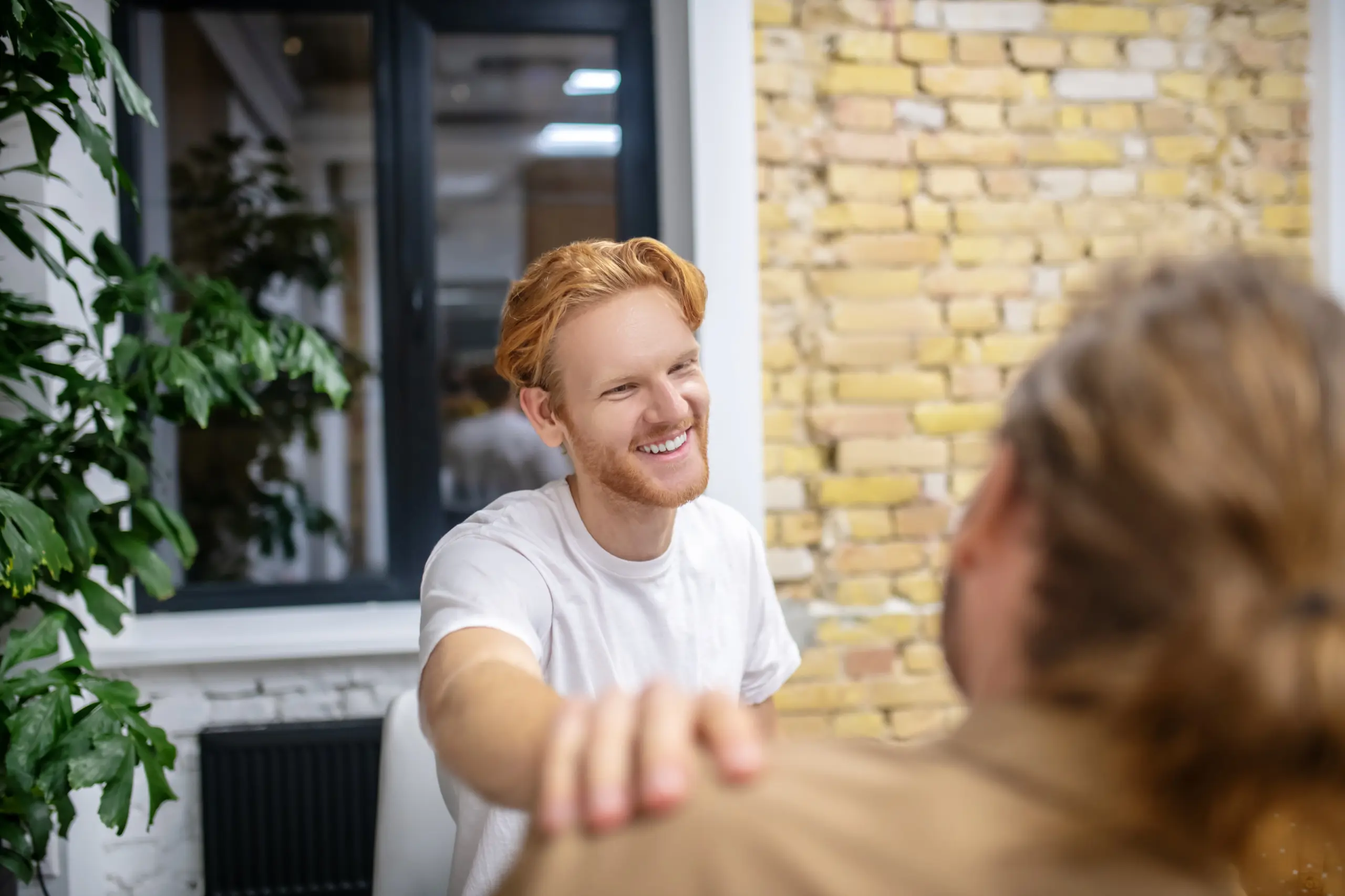 A supportive conversation between two people in a peaceful setting, illustrating the importance of Empathy in Recovery at Casa Leona
