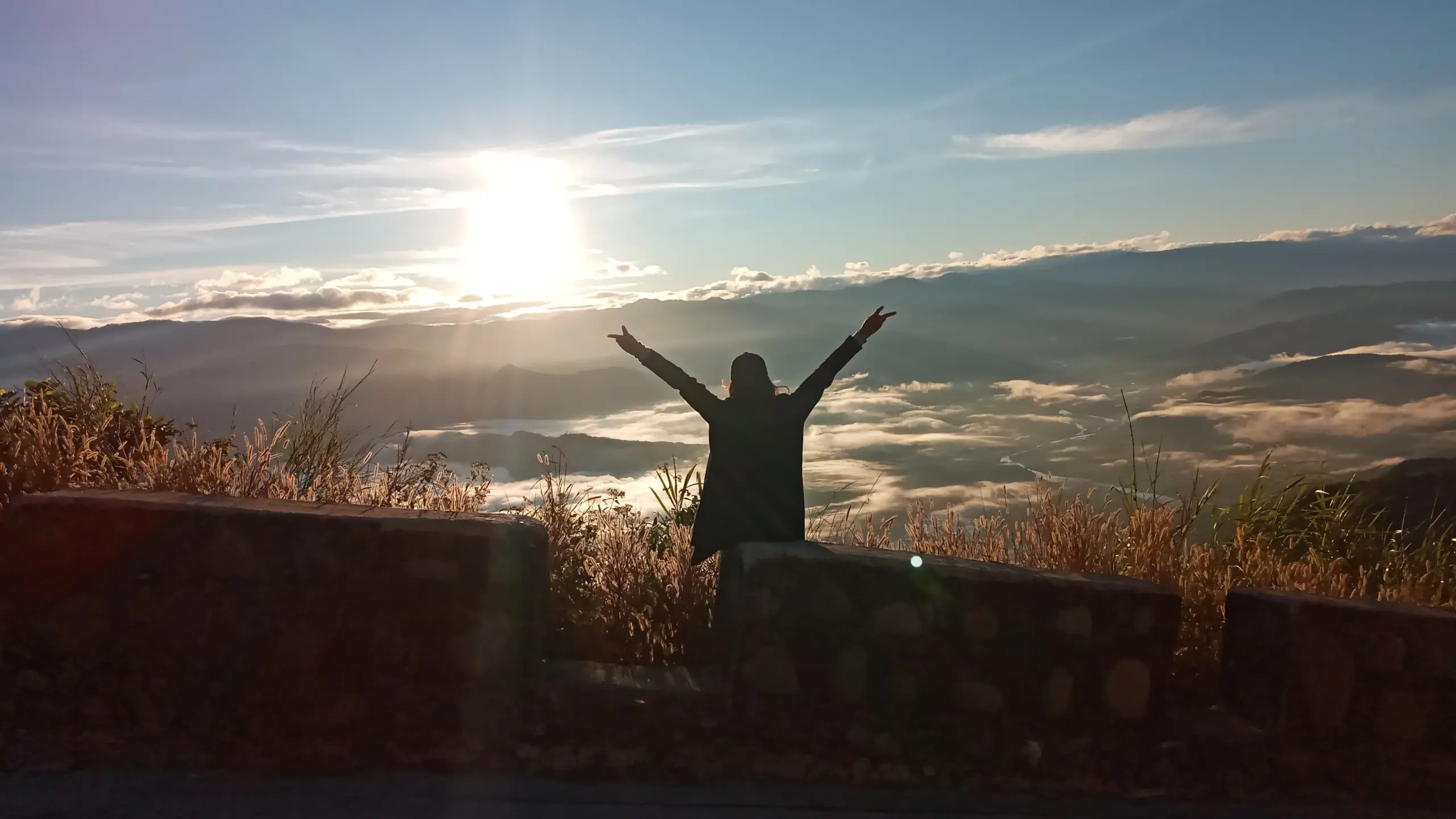 A silhouette of a person standing on a mountain ridge at sunrise, symbolizing a new life vision after inpatient rehab in Leona Valley.
